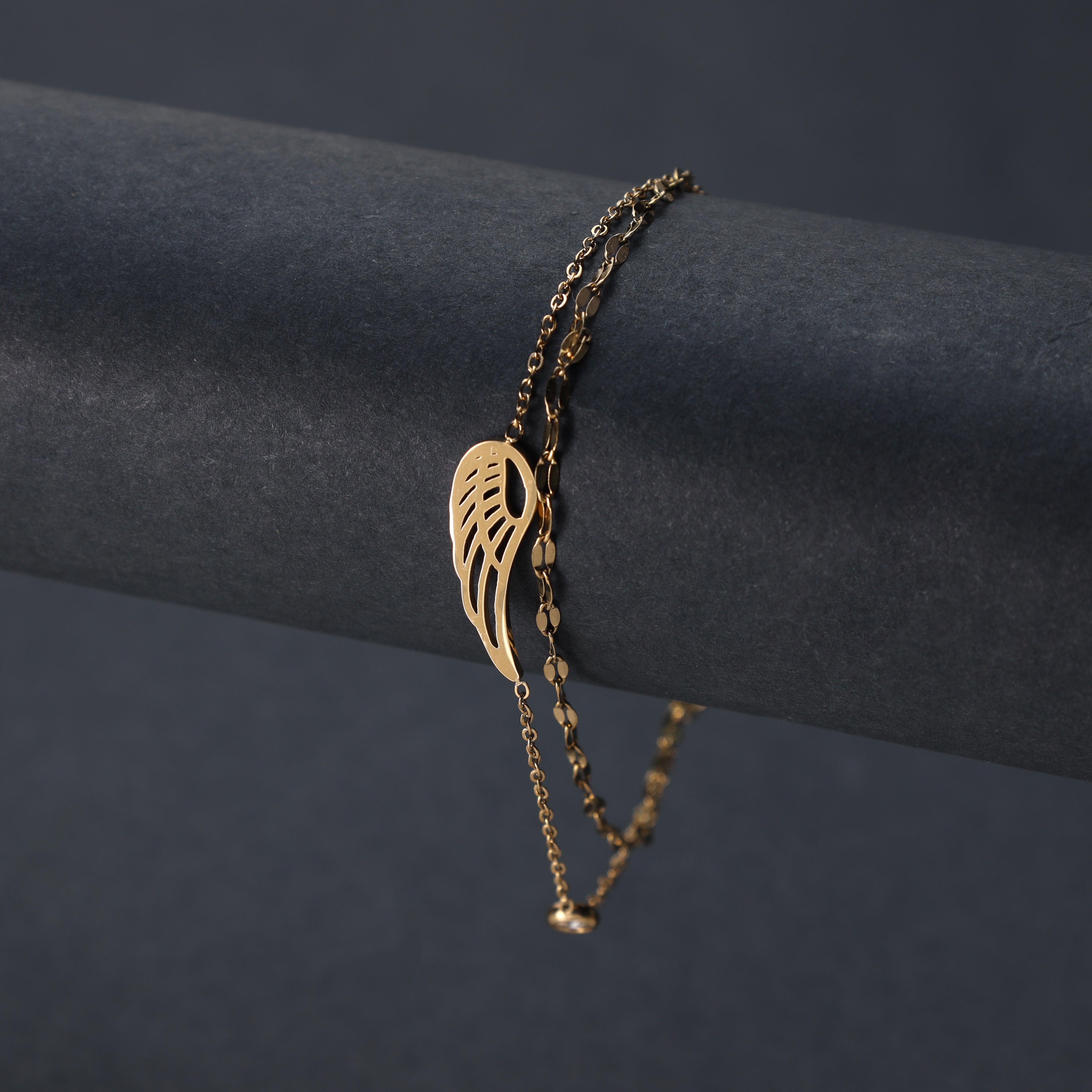 Ladies bracelet with wing motif made of stainless steel 14K gold plated 