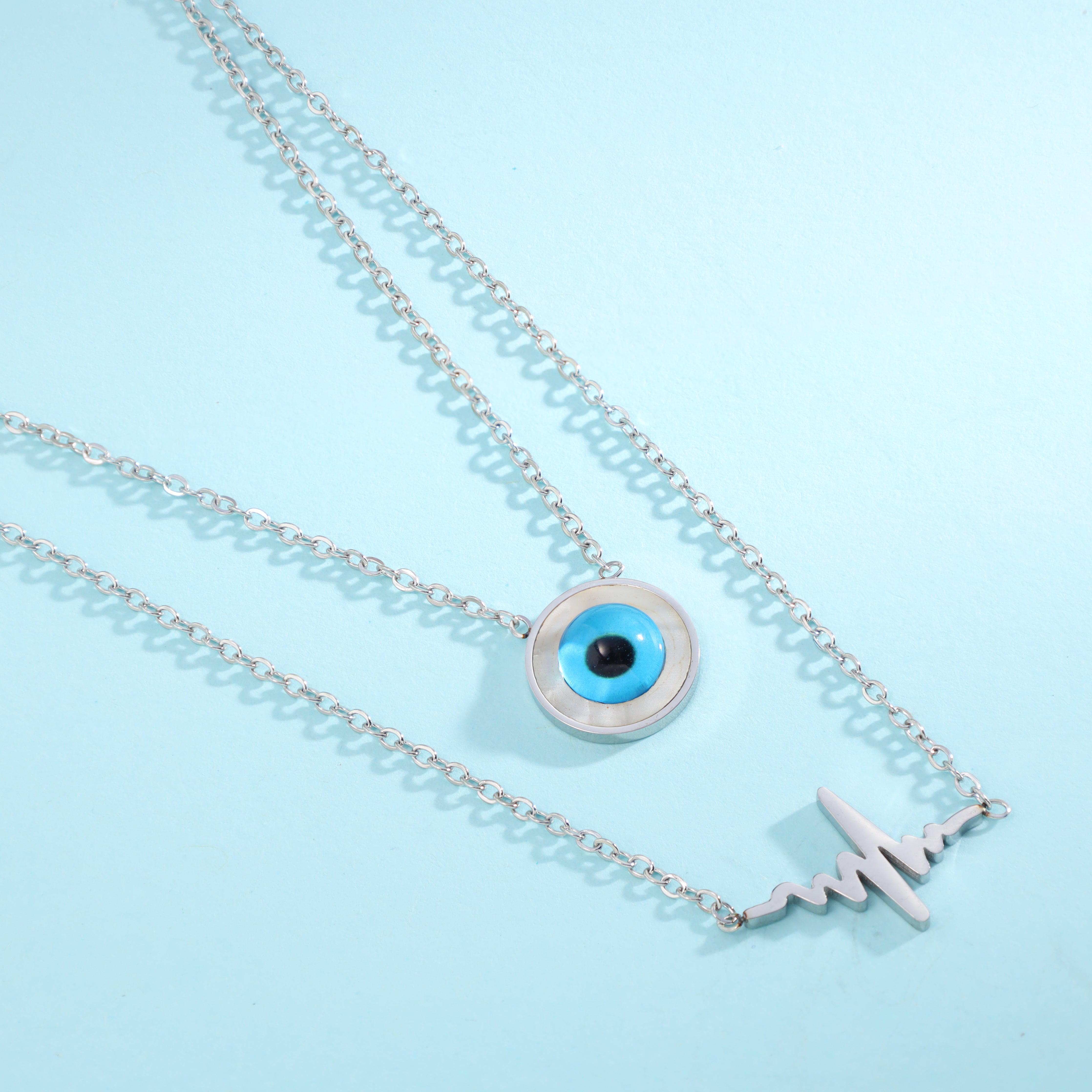 Layering ladies necklace with heartbeat and Evil Eye Nazar pendant made of stainless steel