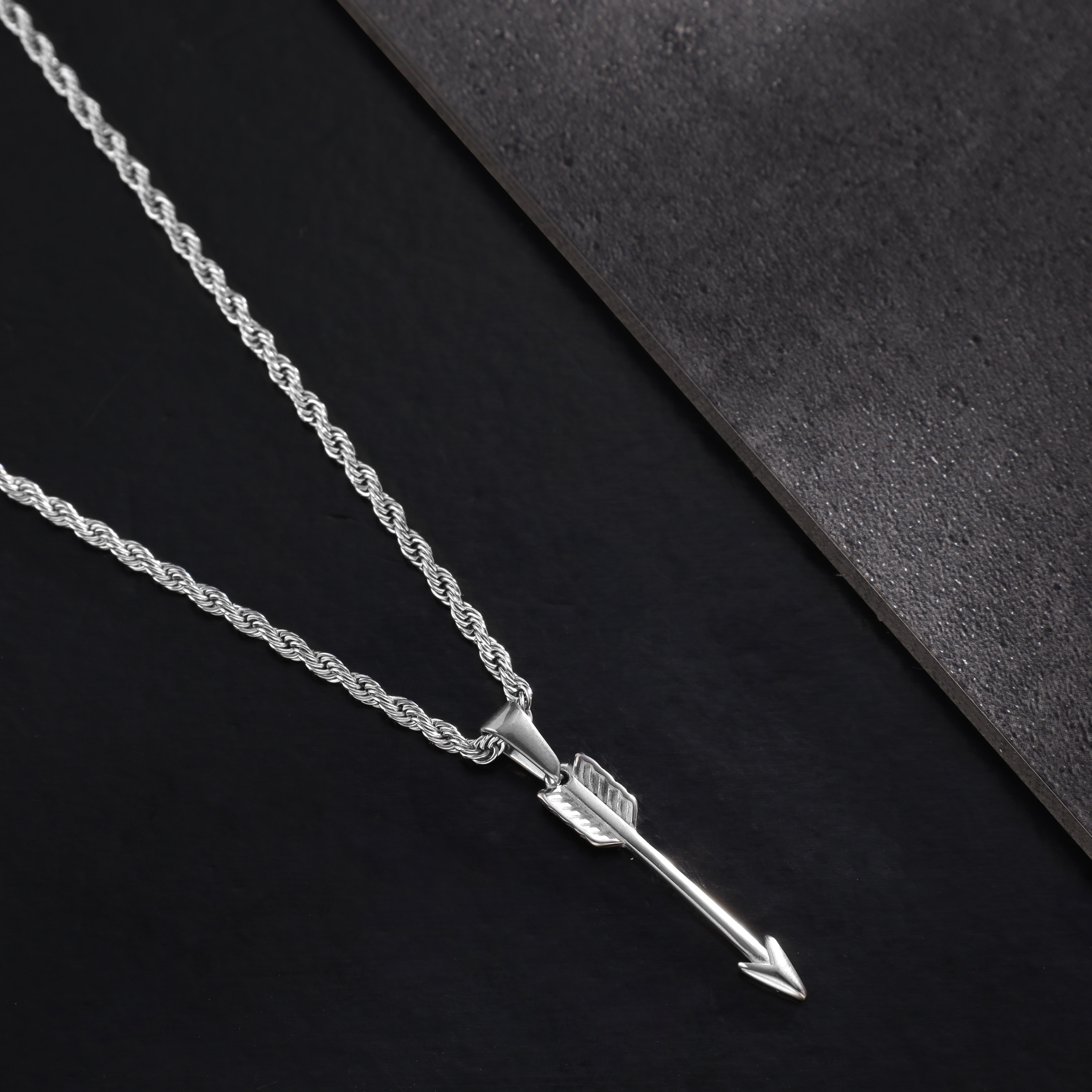 Cord necklace with arrow pendant made of stainless steel 